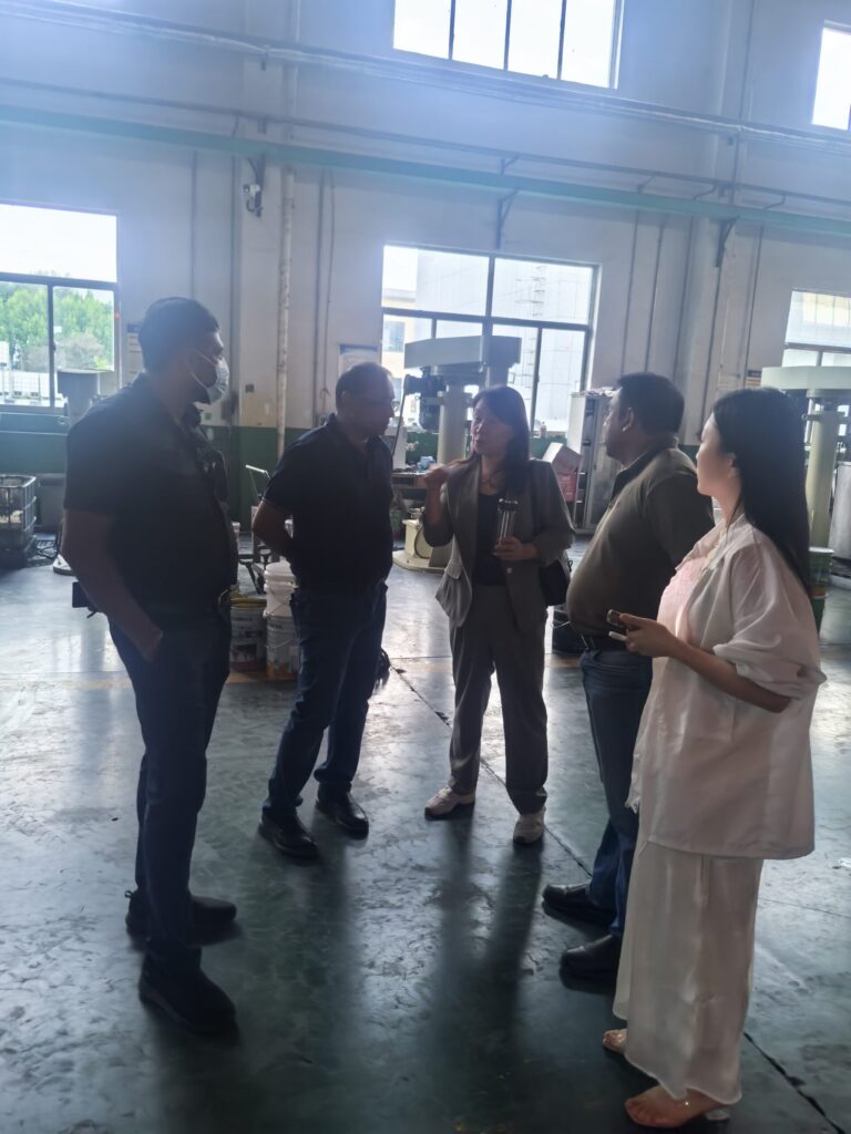 Foreign customers visiting coating production workshop in China